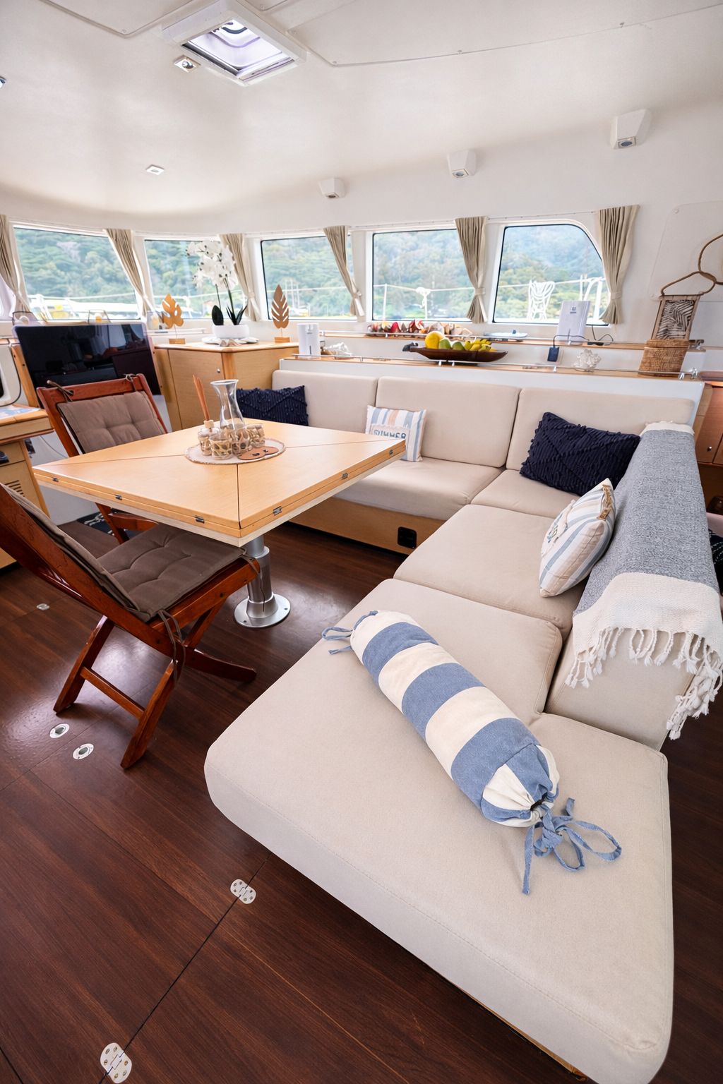 Bright interior saloon with a dining table and cream sofa